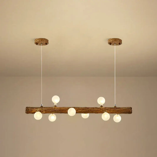 Rustic wooden log pendant light with six frosted glass globe bulbs by DecorBites brown modern linear island pendant lamp