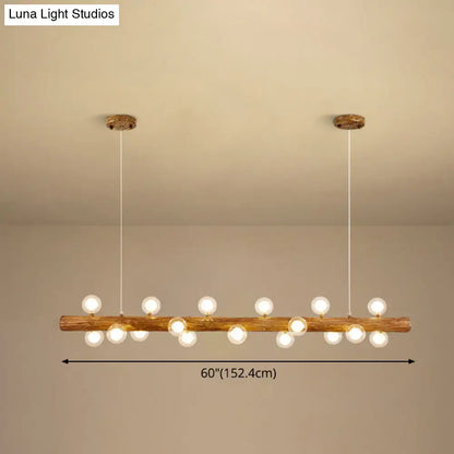 Rustic brown wooden log pendant light with multiple spherical bulbs for modern linear island lighting by DecorBites