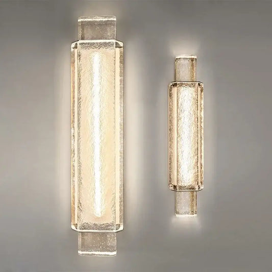 Two modern luxe gold crystal glass wall lamps with textured translucent shades emitting warm glow for bedroom decorbites elegant bubble