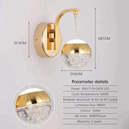 Modern luxurious crystal led wall sconce with gold finish and clear crystal globe housing embedded led lights for bedroom