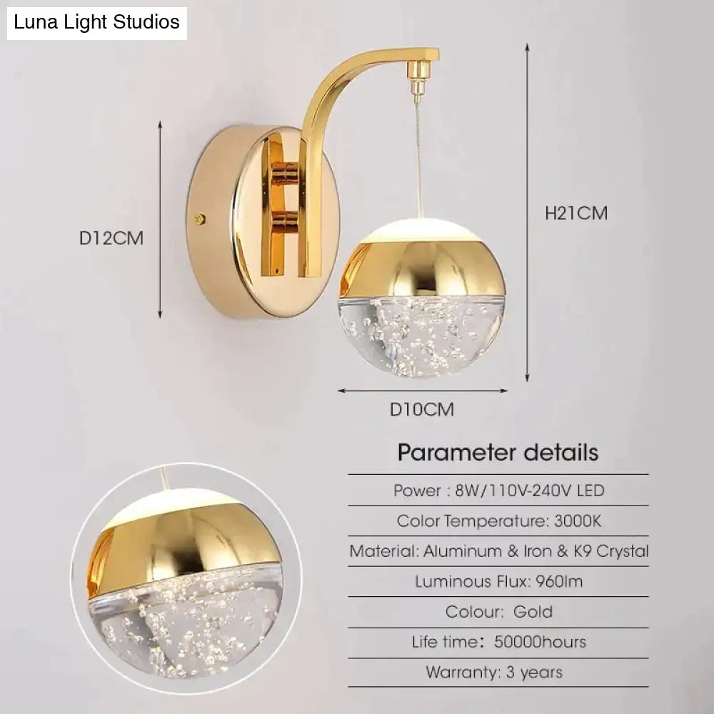 Modern luxurious crystal led wall sconce gold finish with clear globe and embedded sparkling crystals for bedroom lighting