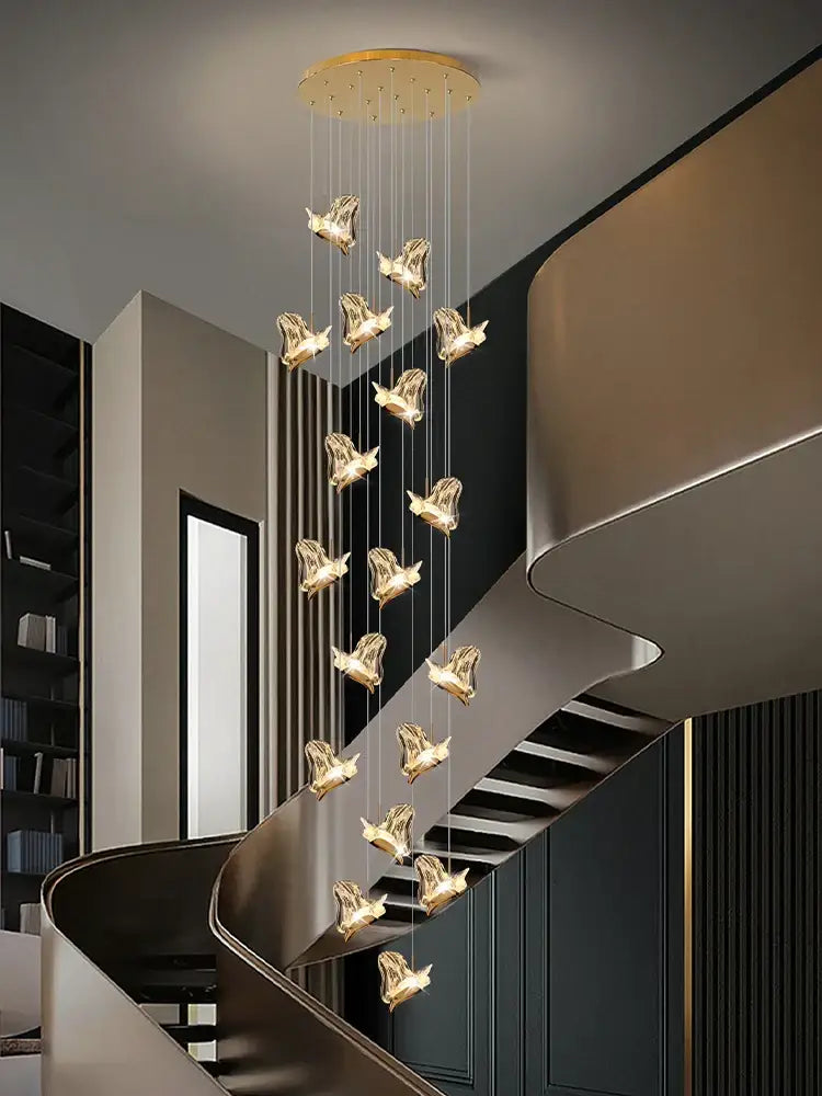 Golden bird-shaped decorbites crystal chandelier with sleek modern design hanging from circular ceiling mount