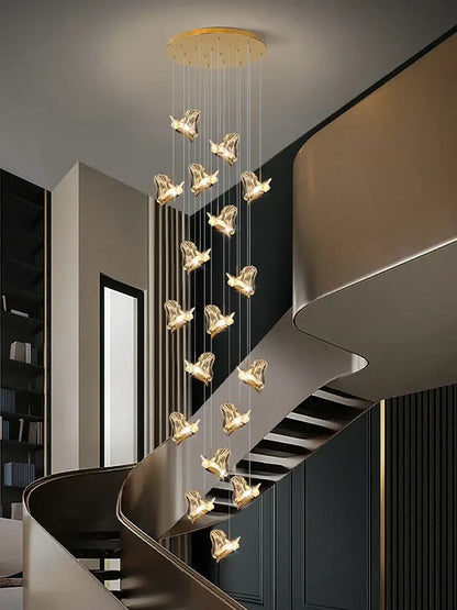 Golden bird-shaped decorbites crystal chandelier with sleek modern design hanging from circular ceiling mount