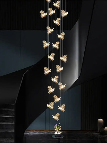 Golden bird-shaped pendant decorbites crystal chandelier with intricate wireframe design for modern luxury living room