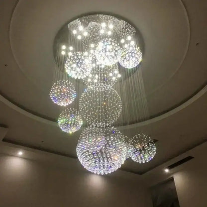 A modern luxury led chandelier with cascading clear and iridescent glass spheres for living room decorbites crystal ball