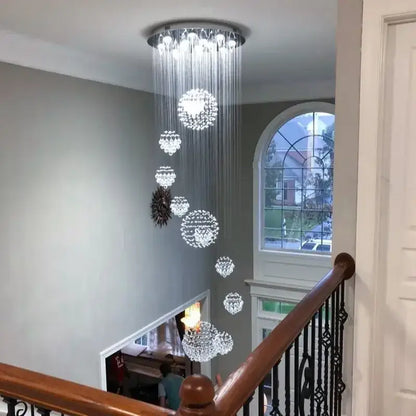 A modern luxury crystal ball led chandelier with cascading spherical orbs and chrome fixture for living room decorbites