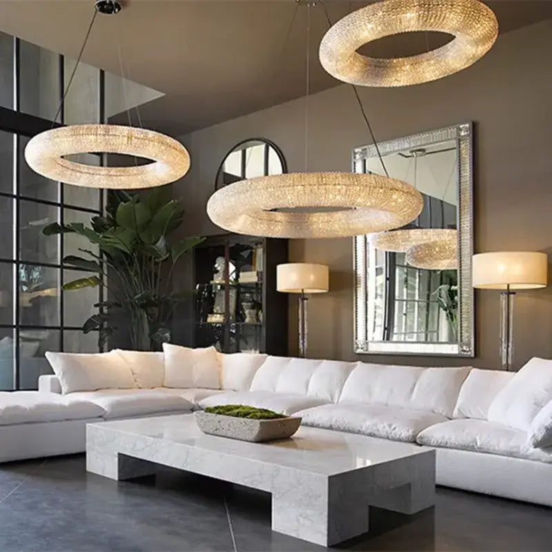 Three elegant crystal circle chandelier pendant lights with sparkling crystals for modern luxury living room decorbites design
