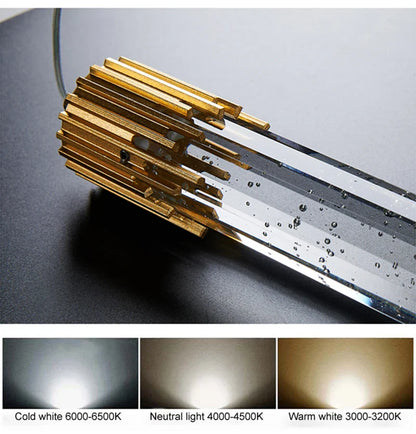 Modern luxury crystal pendant lamp with gold-finished led tube light and clear glass casing for living room decor