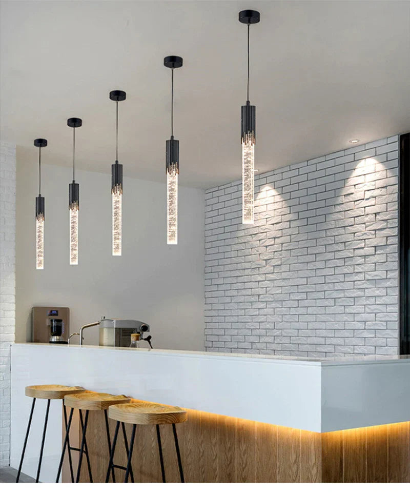 Modern luxury crystal pendant lamps featuring sleek black and clear glass cylindrical design for living room lighting