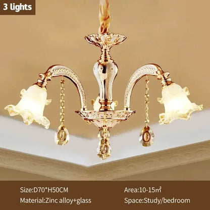 Modern luxury gold crystal ceiling chandelier with three ornate arms, frosted glass shades, and dangling decorbites crystals