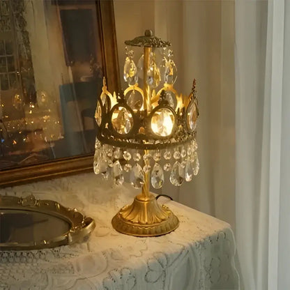 Modern luxury gold crystal crown chandelier with ornate table lamp design featuring dangling crystal droplets and glass panels