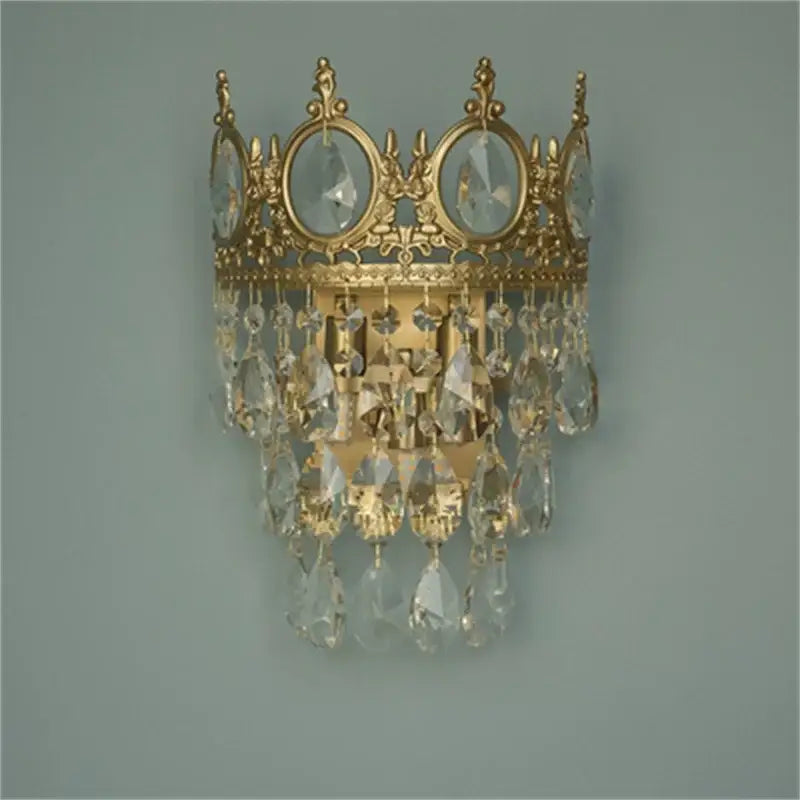 Gold-toned crystal crown chandelier wall sconce with dangling crystal droplets by decorbites for elegant living room decor
