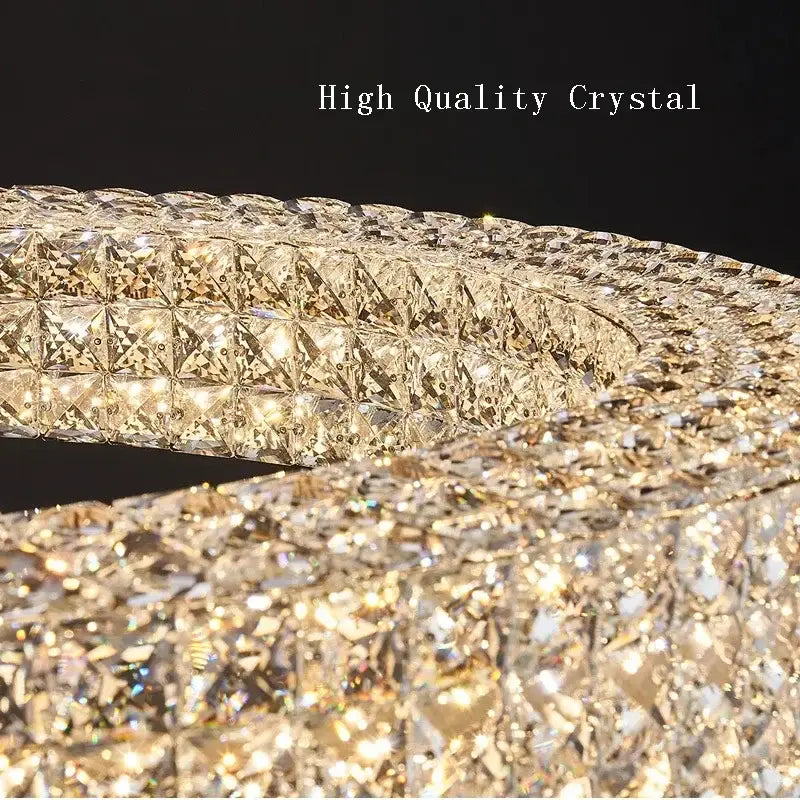 A luxurious modern luxury gold crystal led ceiling chandelier with intricate faceted decorbites crystal led design