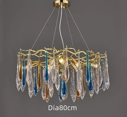 Modern luxury golden crystal water drop led chandelier with a golden frame and glass teardrop pendants in clear blue and amber hues