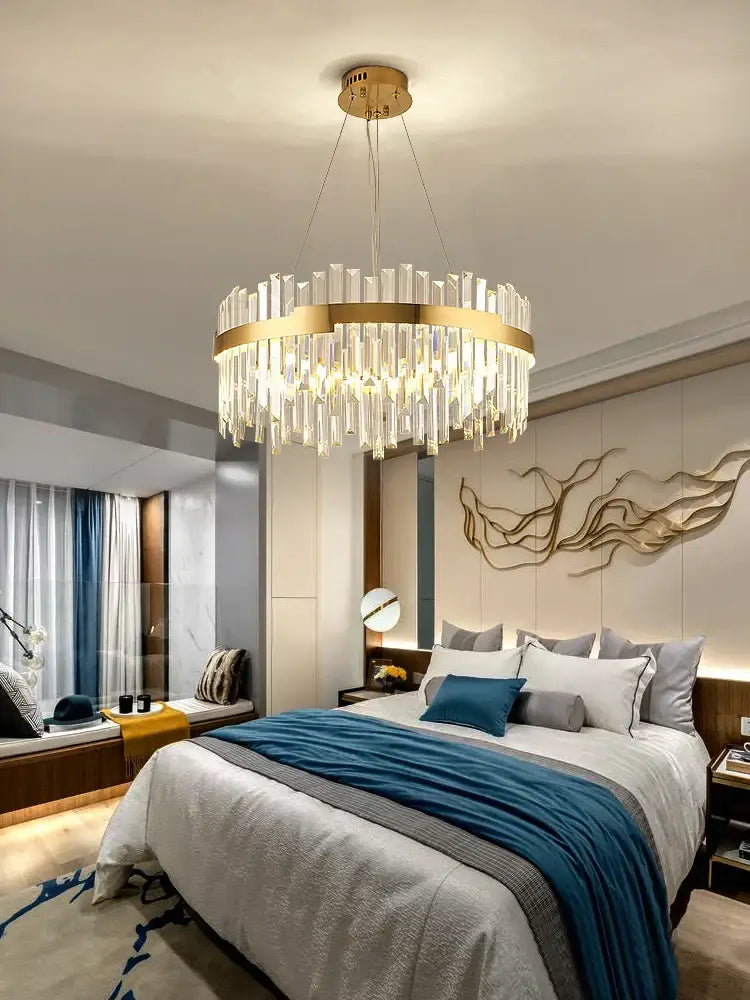 Modern luxury spectrum gold crystal chandelier with cascading clear prisms for elegant dining room lighting