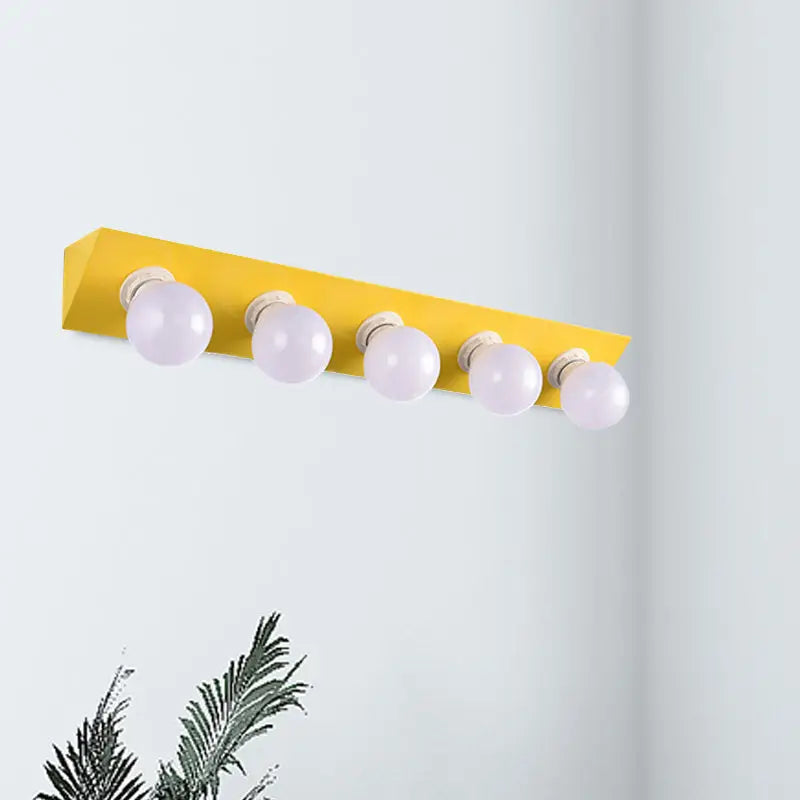 Modern macaron pink and yellow vanity sconce with five spherical frosted bulbs for bathroom lighting