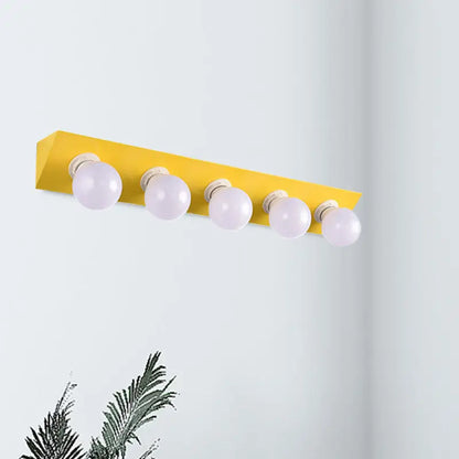 Modern macaron pink and yellow vanity sconce with five spherical frosted bulbs for bathroom lighting