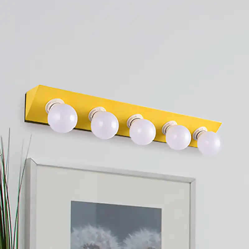 Modern macaron yellow vanity sconce with five spherical white bulbs for bathroom lighting and decor