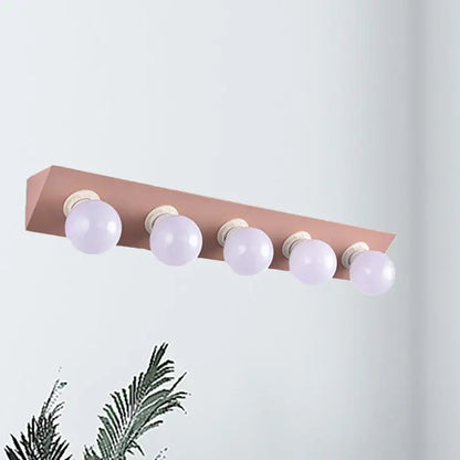 Rose gold rectangular vanity sconce with five frosted globe bulbs modern macaron pink and yellow 5-light sconce light