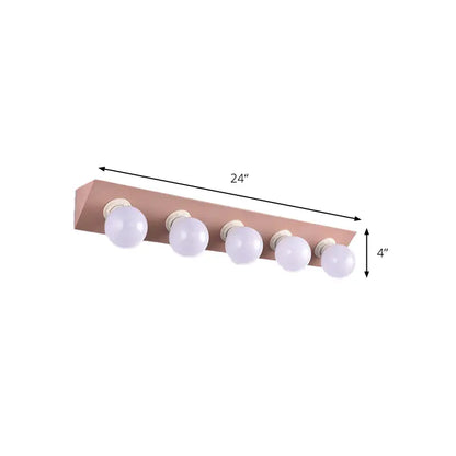 Rose gold rectangular vanity sconce with five spherical white bulbs for modern macaron pink and yellow bathroom light