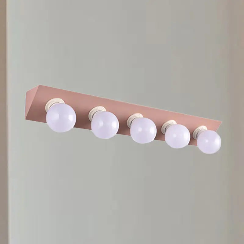 Modern macaron pink and yellow 5-light vanity sconce with rose gold finish and five spherical bulbs for bathroom lighting