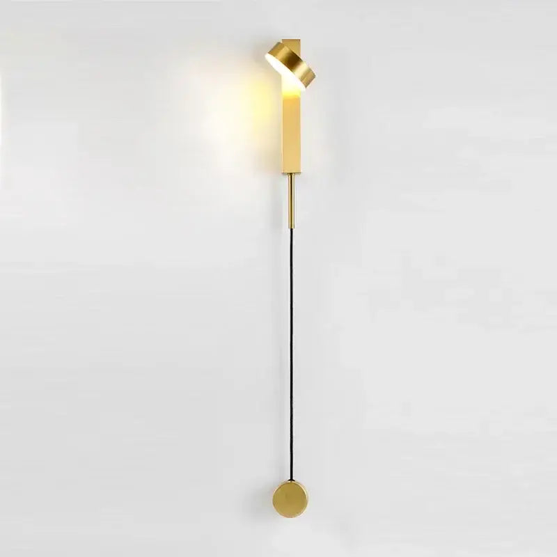 Gold-toned modern wall lamp with sleek twisted head and cylindrical base for decorbites black rotation led bedroom light fixture