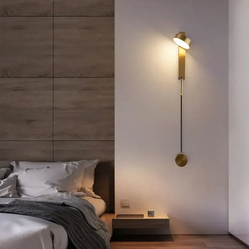 Gold-toned modern wall lamp with adjustable head and circular base for decorbites black rotation led bedroom light fixture