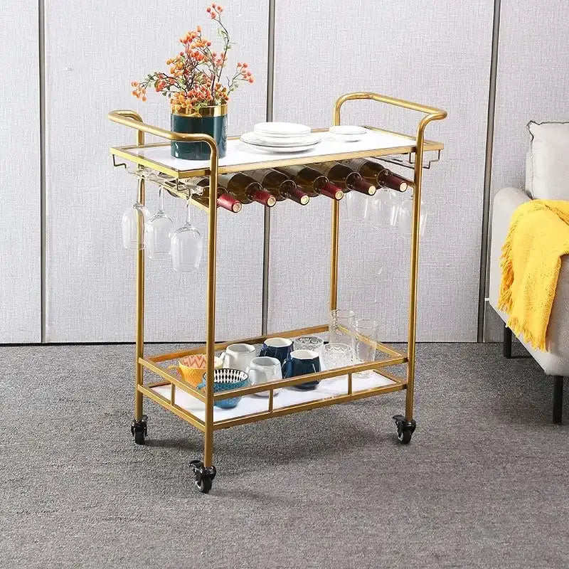 Modern marble and gold drinks trolley with white marble top, glass shelves, wine holders, and decorbites drinks trolley design