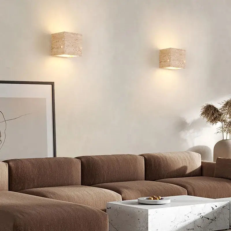Two beige modern marble cuboid stone led wall lamps with textured surface and warm light for bedroom decorbites cuboid stone sconce set