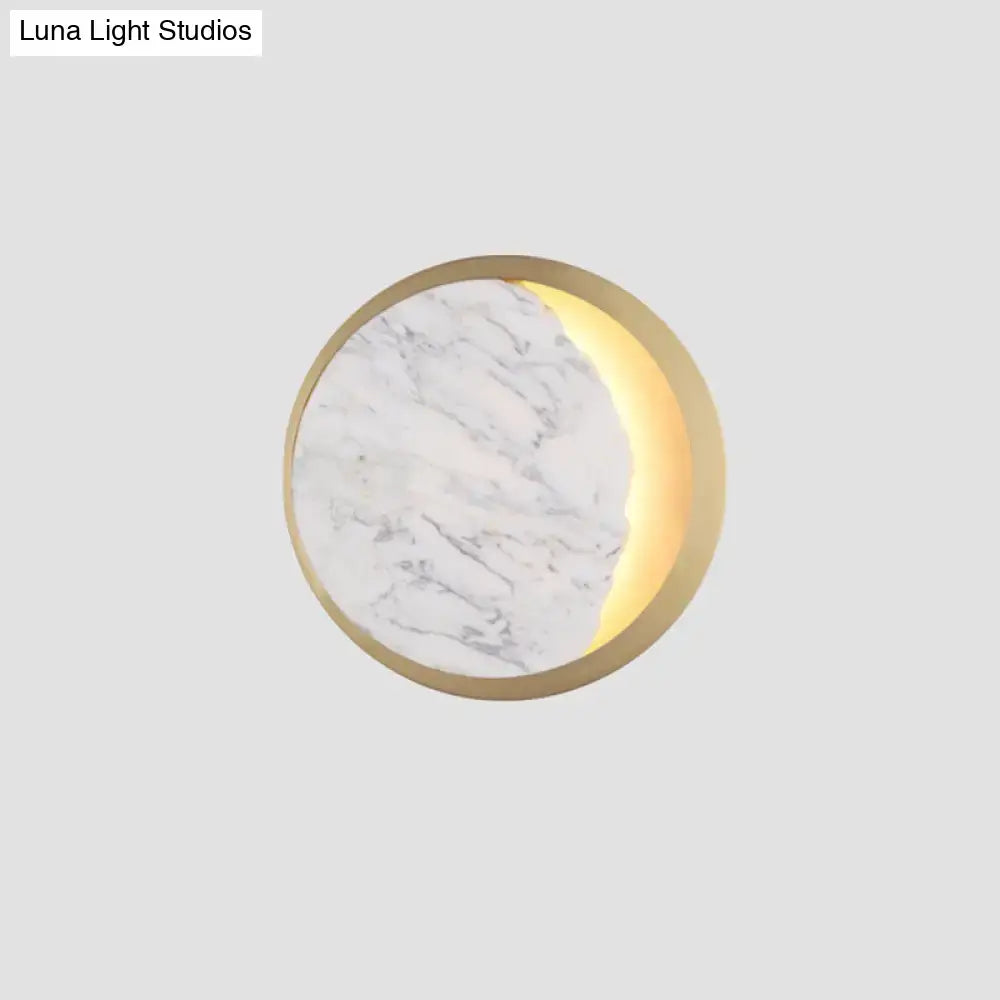 Modern marble gold led wall light featuring a circular white marble surface with illuminated gold led crescent moon design