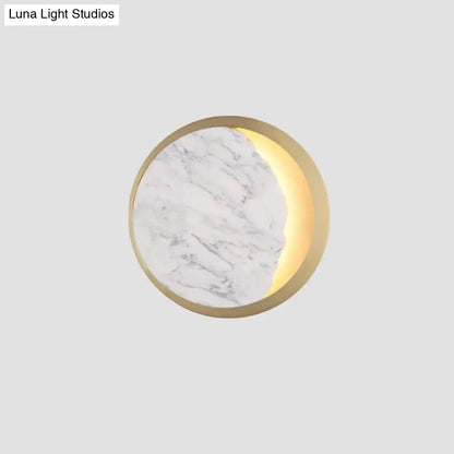 Modern marble gold led wall light featuring a circular white marble surface with illuminated gold led crescent moon design