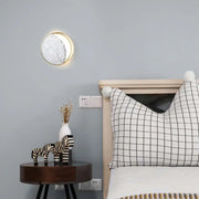 Circular wall-mounted mirror with gold led wall light and marble gold led frame for modern bedroom use