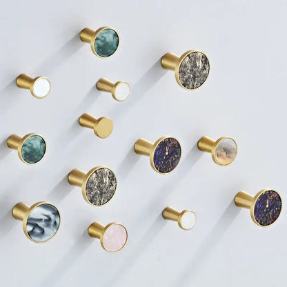 Modern marbled stone and decorbites brushed gold towel hook with circular marble inlays for bathroom decor