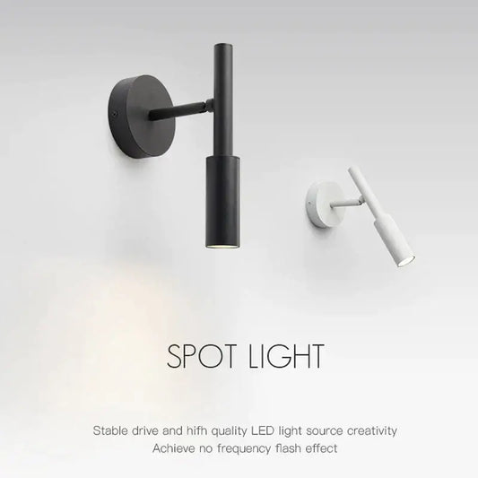 Modern matte black adjustable led wall lamp with cylindrical head and arm, perfect as a bedroom reading wall lamp night light