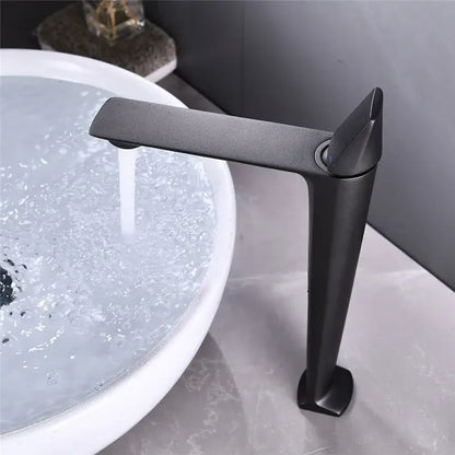 Modern matte black and white brass sink faucet with sleek angular design for black brass bathroom by decorbites