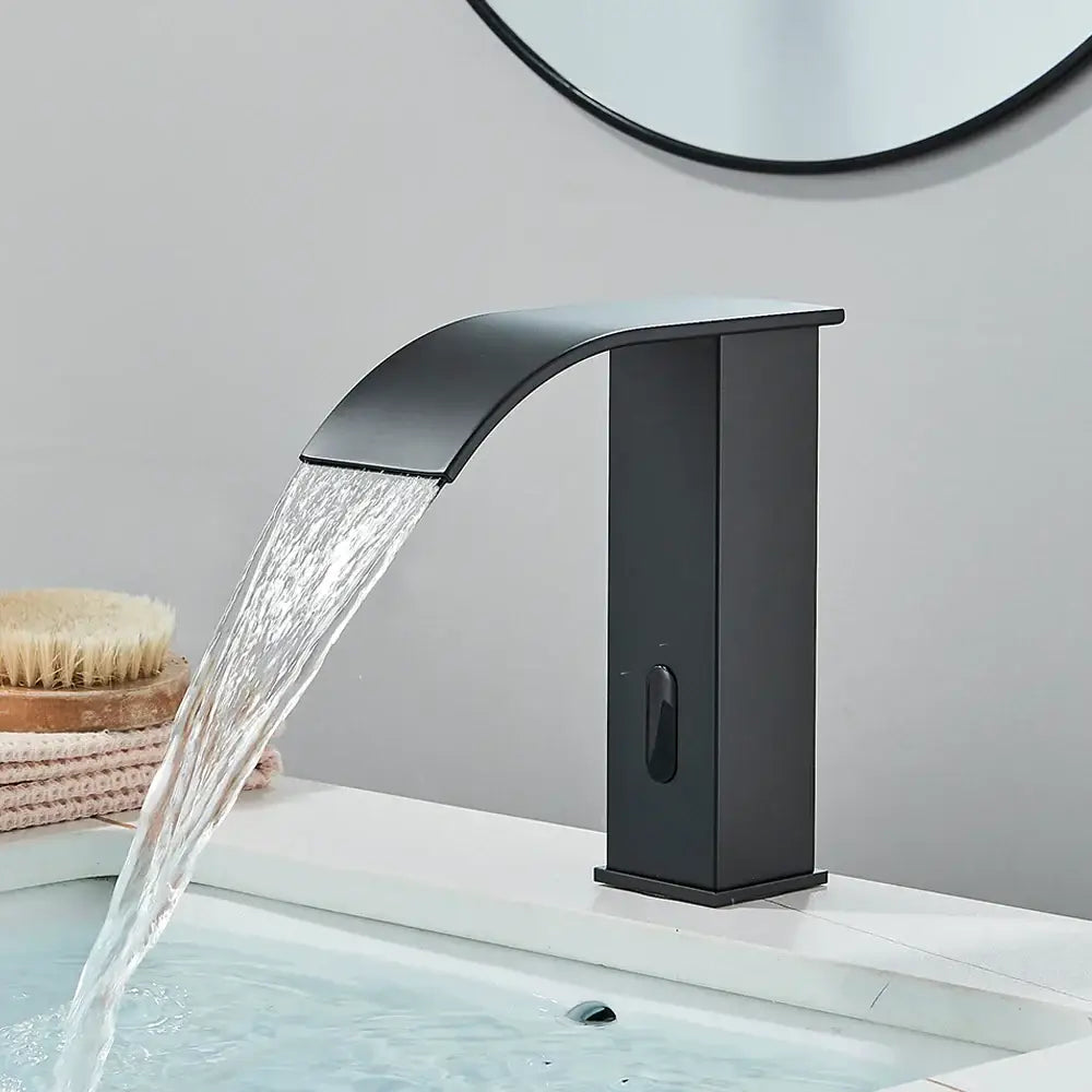 Modern matte black automatic sensor waterfall basin faucet with sleek curved spout and rectangular body for bathroom sink