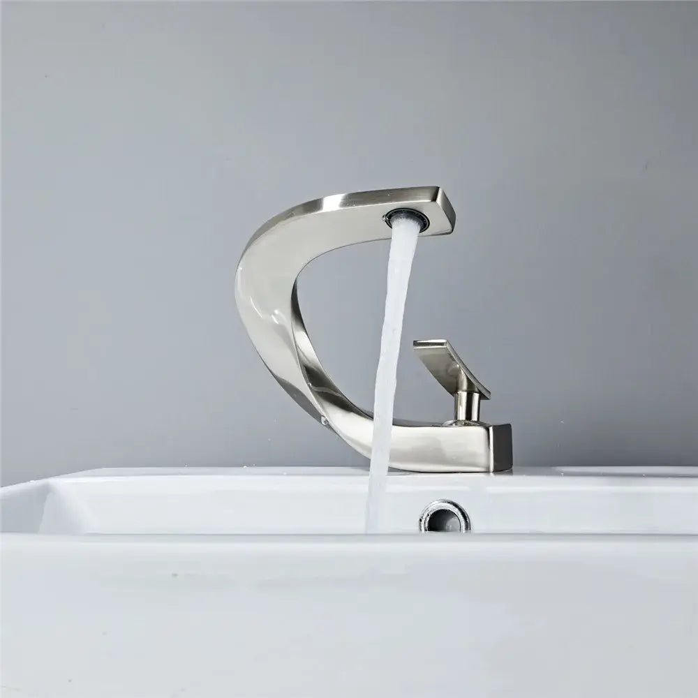 Modern matte black basin faucet with brushed nickel single lever handle and sleek curved design for bathroom use