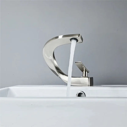 Modern matte black basin faucet with brushed nickel single lever handle and sleek curved design for bathroom use