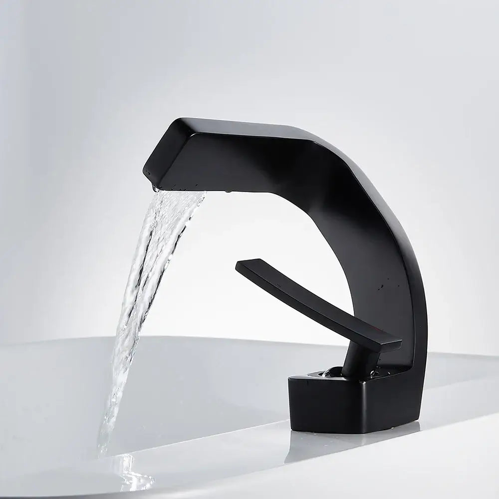 Modern matte black basin faucet with waterfall spout and sleek curved design for bathroom use