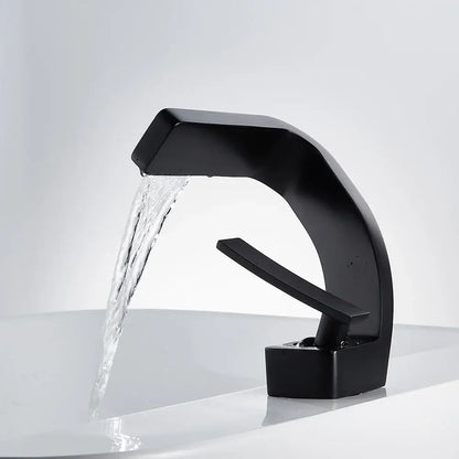 Modern matte black basin faucet with waterfall spout and sleek curved design for bathroom use