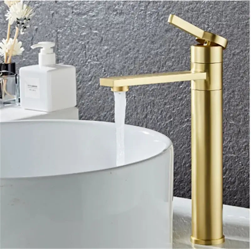 Modern matte black basin faucet with decorbites gold solid brass construction and a sleek gold-toned rectangular spout