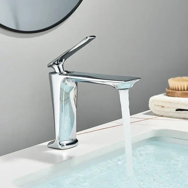 Modern chrome finished basin mixer with sleek minimalist design and waterfall spout for decorbites black basin mixer