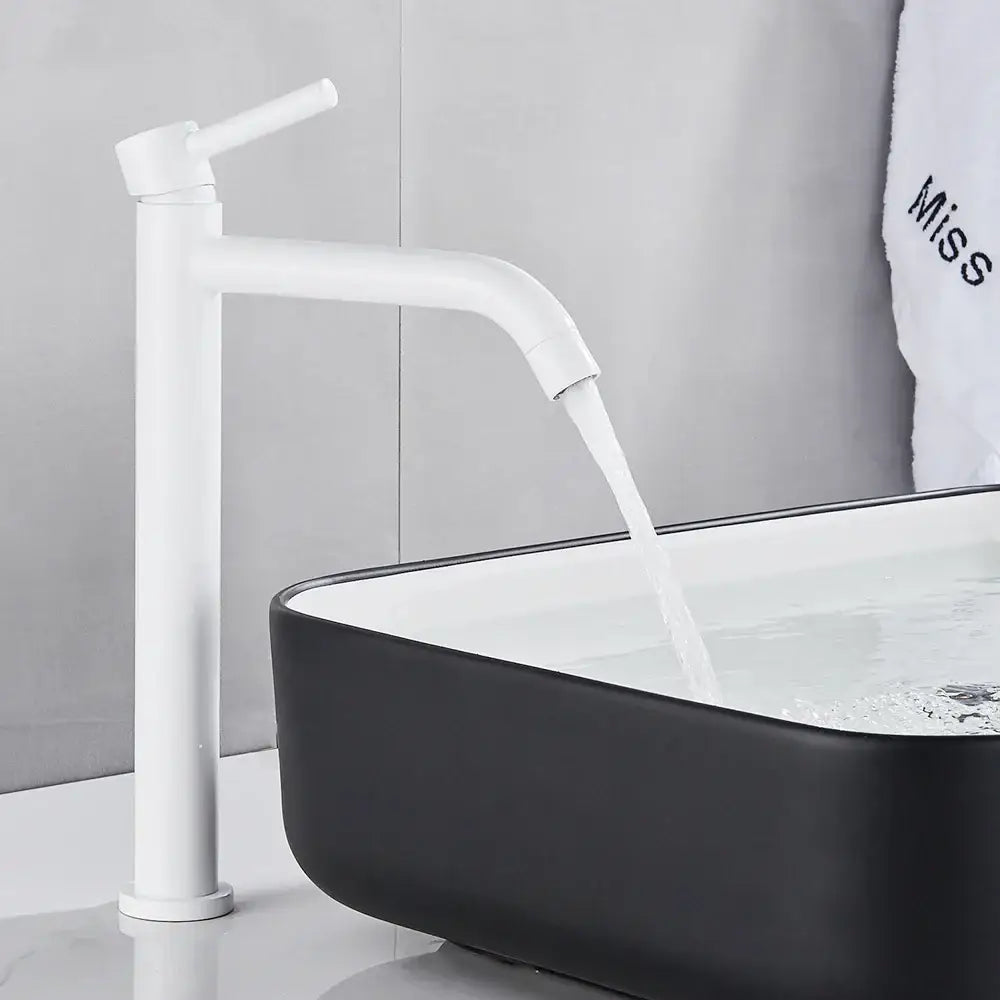 Modern white matte-finish basin mixer tap with tall slender spout and curved handle for bathroom sink use