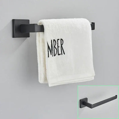 Modern matte black bathroom hardware set with square towel rail holding a white towel on a black bathroom hardware rack
