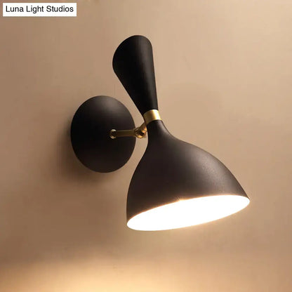 Modern matte black and brass wall lamp with adjustable arm emitting warm light suitable for 220v-240v 110v-120v light type