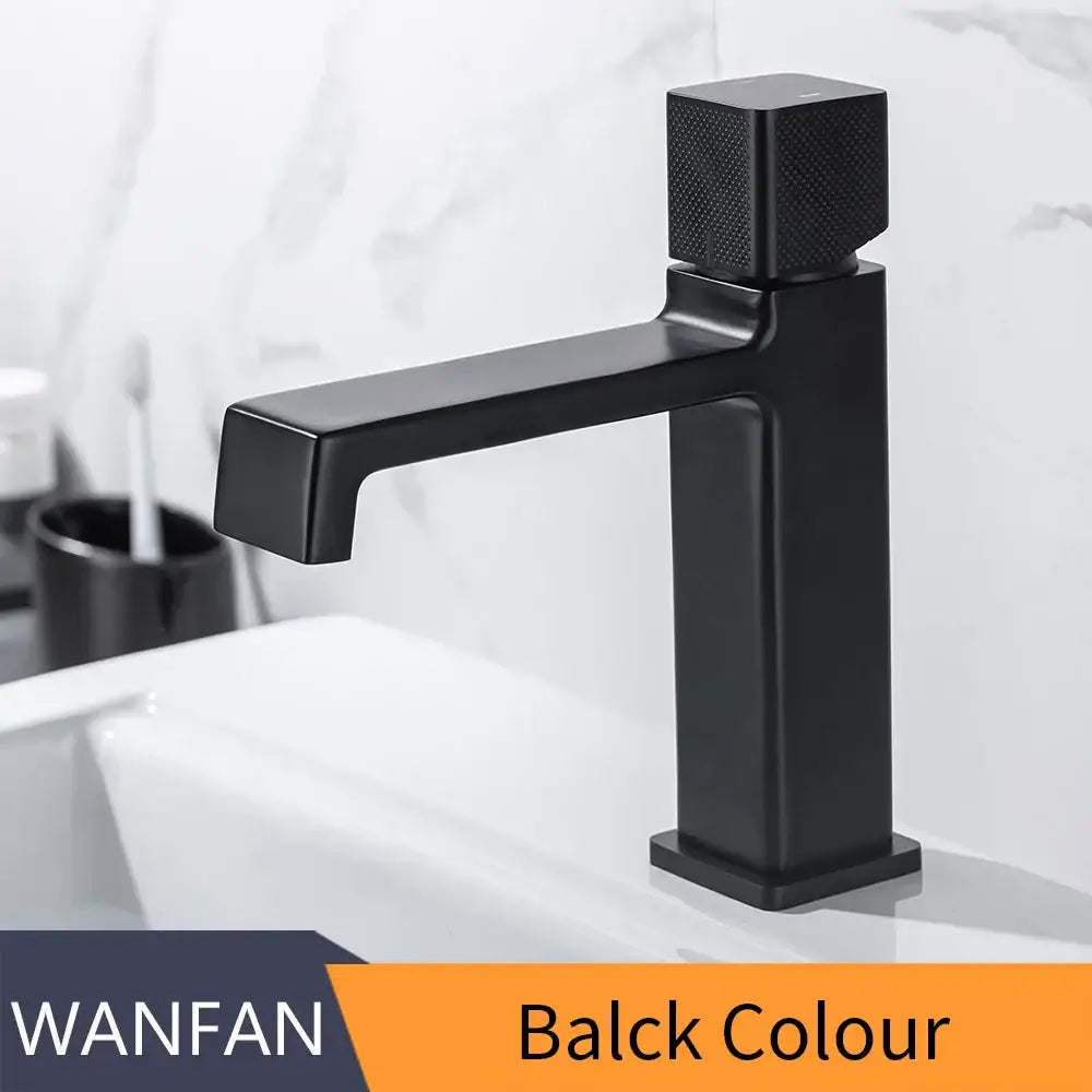 Modern matte black brass basin faucet with textured square handle and sleek rectangular spout by decorbites black brass basin