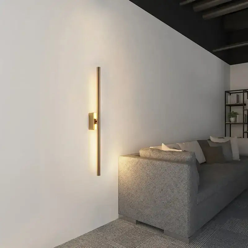 A sleek modern matte black and brass gold led wall light bedroom sconce with decorbites brass gold ambient lighting
