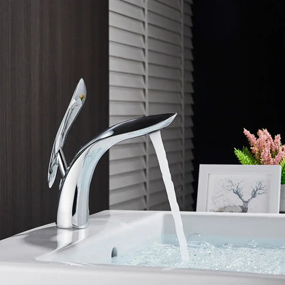 Modern chrome brass washbasin faucet with sleek sculptural design and single spout for decorbites brass washbasin
