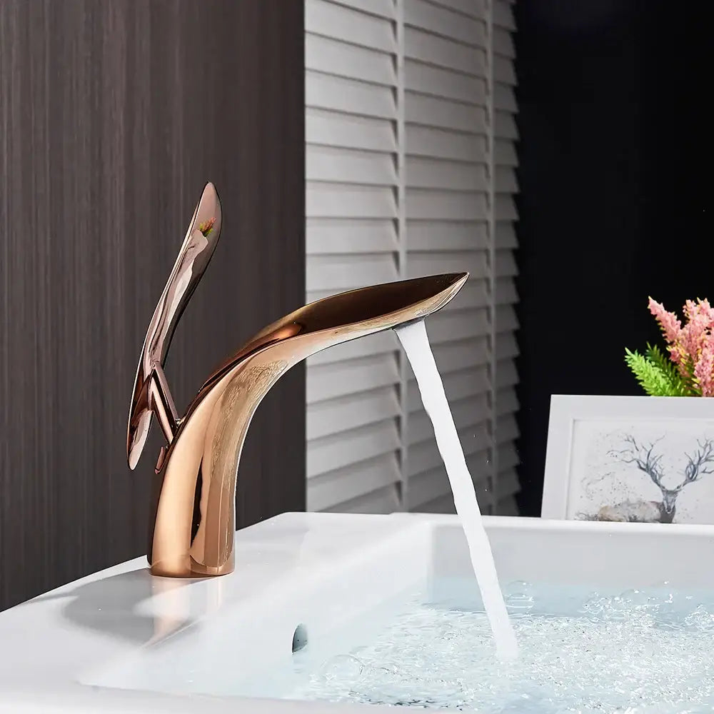 Modern matte black brass washbasin faucet with rose gold curved spout and handle by decorbites brass washbasin