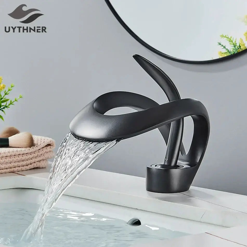 Modern matte black brass waterfall basin faucet with black matte finish and sleek design for bathroom vanity use